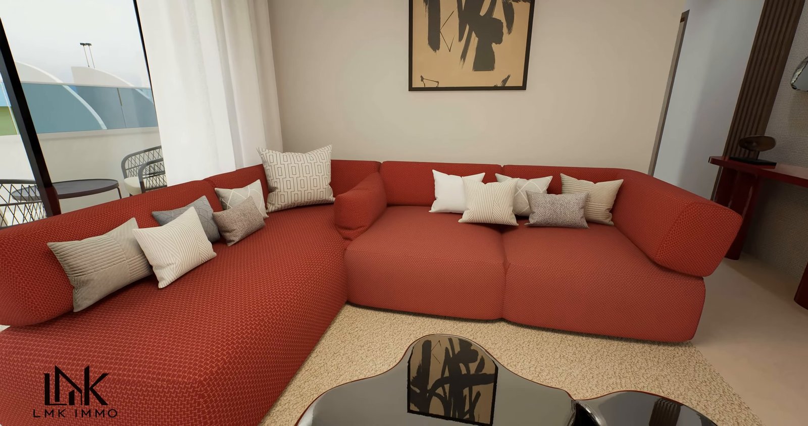 Appartement témoin T4 — salon et canapé d’angle rouge
